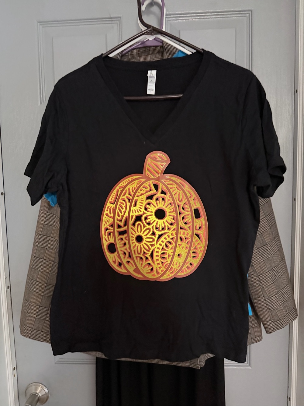Black women’s large V-Neck Tee with Orange Pumpkin Graphic